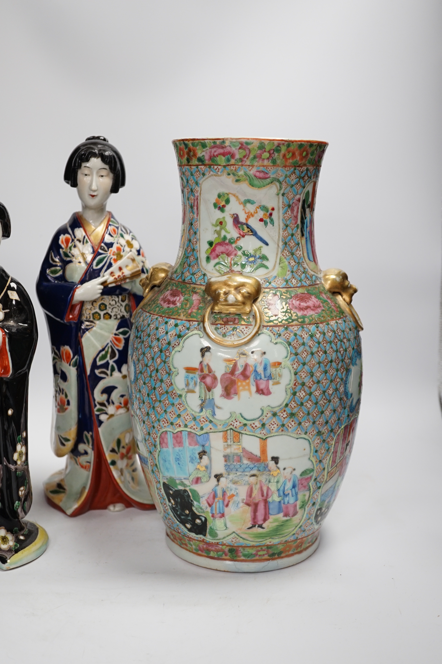 Two Japanese figures wearing kimonos, early 20th century and a 19th century Chinese famille rose vase, largest 34cm high